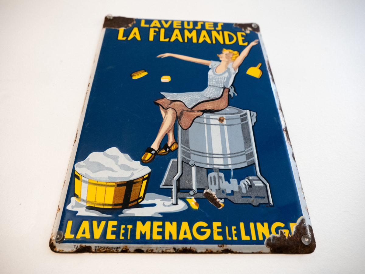 Plaque émaillée publicitaire pour la machine "laveuse la flamande"